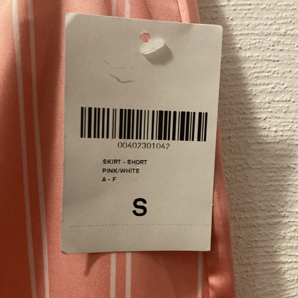 Pink silky mini skirt.   Forever 21 - Picture 3 of 5